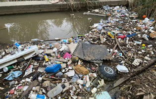 Plastic waste in a creek bed at Fairmount Park in Riverside, Calif.